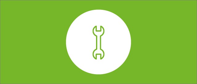 Runder weißer Kreis mit einem Schraubenschlüssel als Icon auf grünem Hintergrund